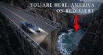 An image of a speeding sports car on a winding mountain road about to drive off a steep cliff created by a hole in the road. White text states YOU ARE HERE: AMERICA ON RED ALERT with a red arrow pointing to the hole in the road.